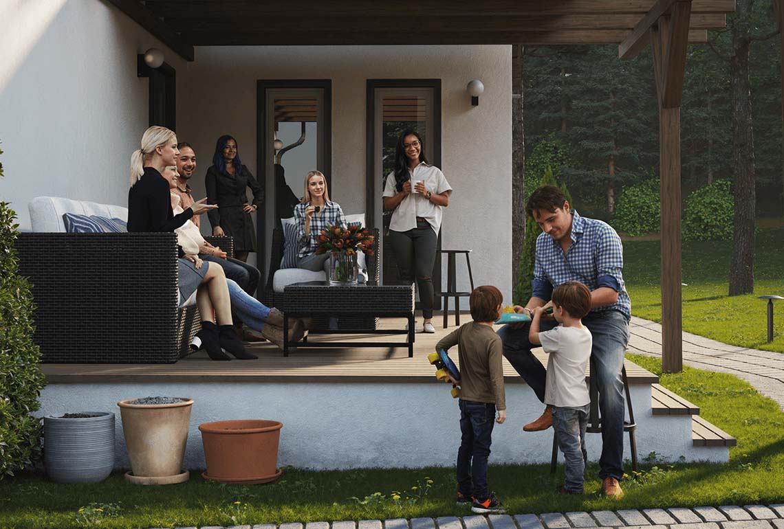 گروهی از افراد در ایوان خانه در حال معاشرت، بزرگسالان روی مبلمان فضای باز و دو کودک در حال بازی روی چمن.