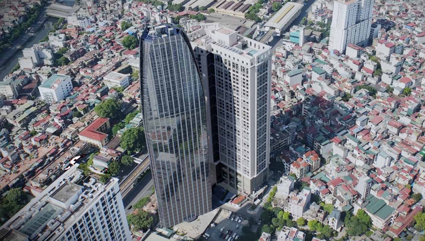 نمای هوایی یک آسمان‌خراش مدرن با نمای شیشه‌ای منحنی که توسط ساختمان‌های متراکم شهری و خیابان‌های اطراف احاطه شده است.